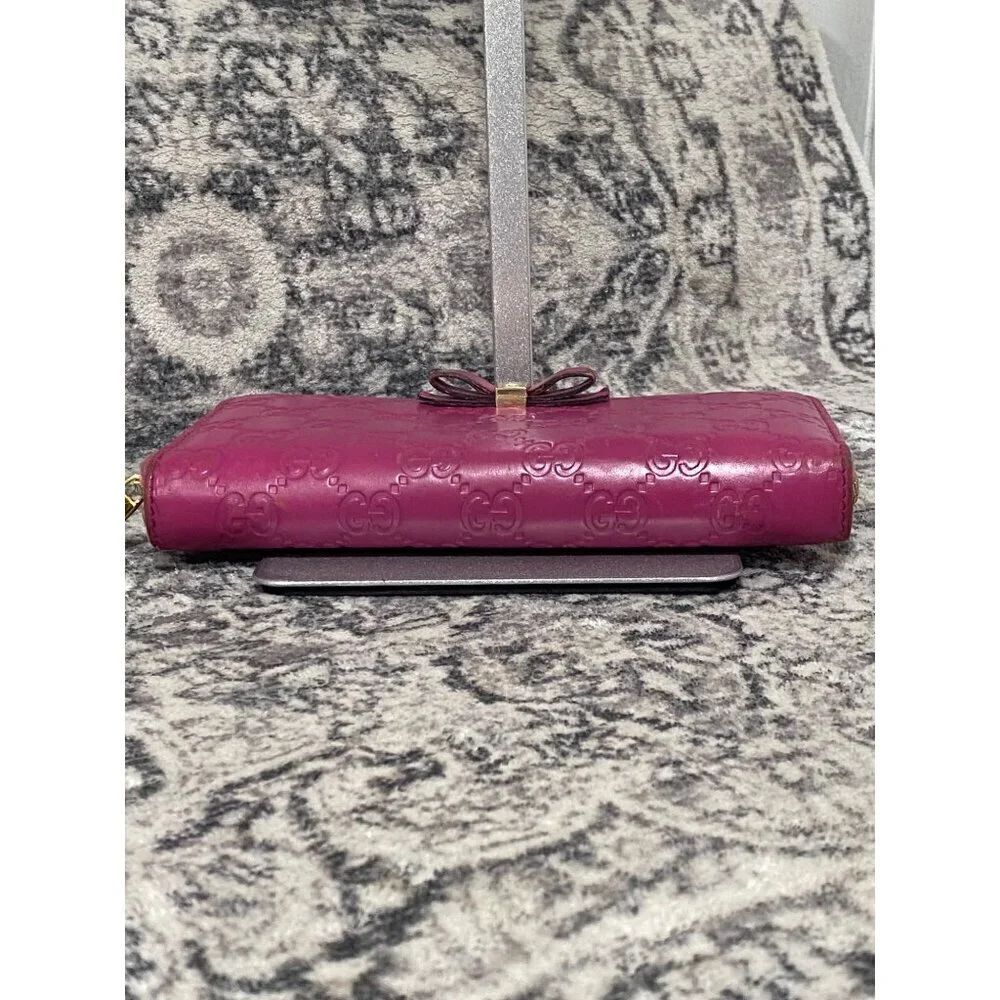 Gucci Guccissima Bow Zip Around Long Wallet in Fuschia